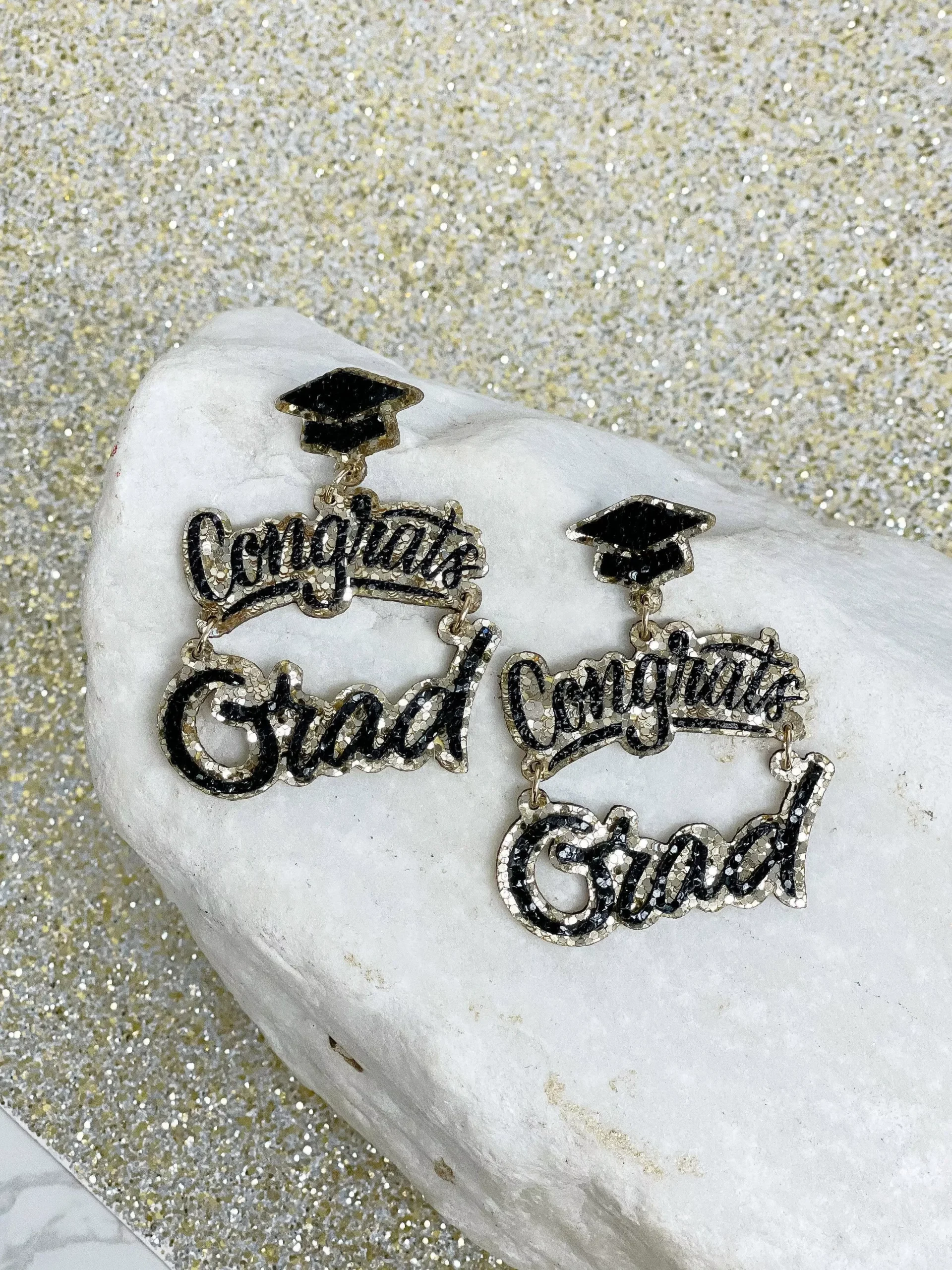 Prep Obsessed Wholesale – Gold Glitter Cursive ‘Congrats Grad’ Dangle Earrings