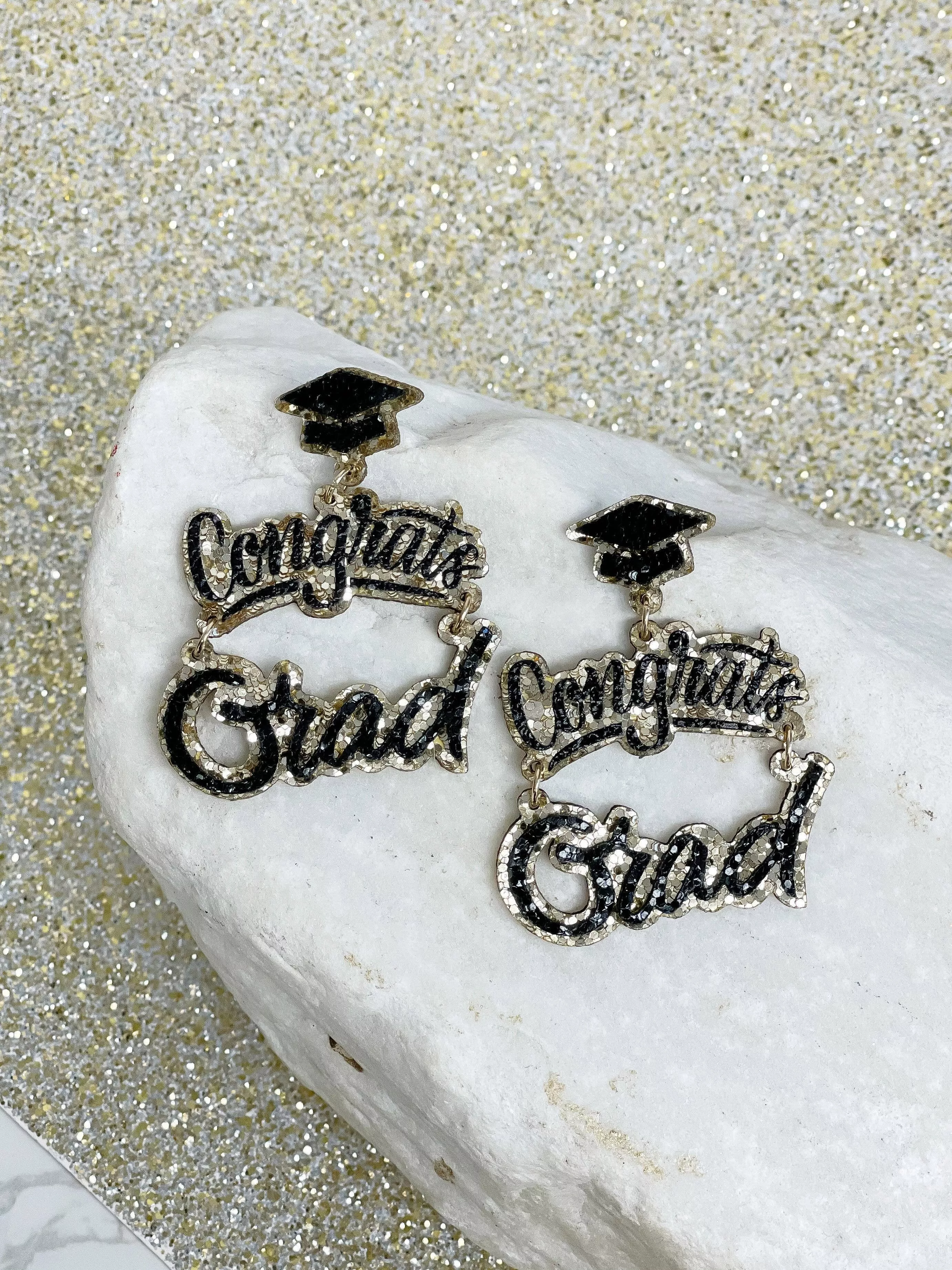 Prep Obsessed Wholesale - Gold Glitter Cursive 'Congrats Grad' Dangle Earrings